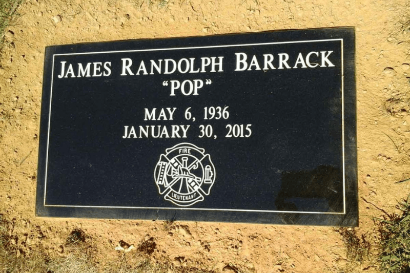 Black granite flat grave marker with engraved name and firefighter emblem